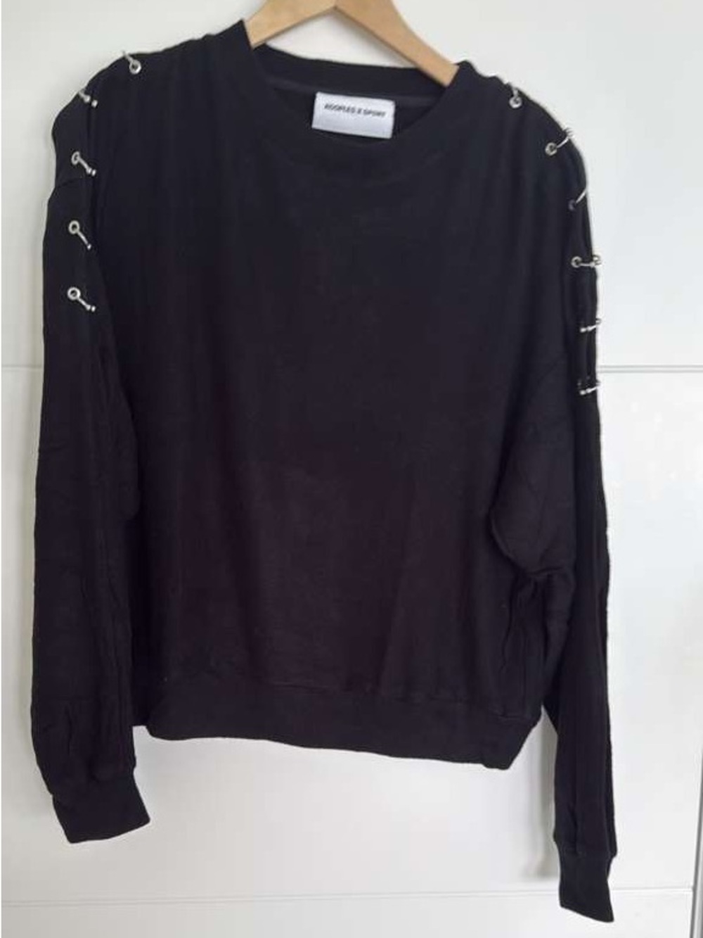 Black Kooples long sleeve top with silver eyelets